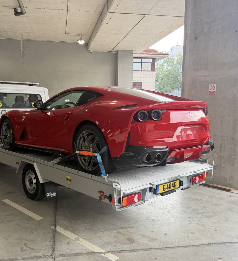 A Ferrari strapped down on the alloy deck of Altimore's Citroën Relay flatbed.