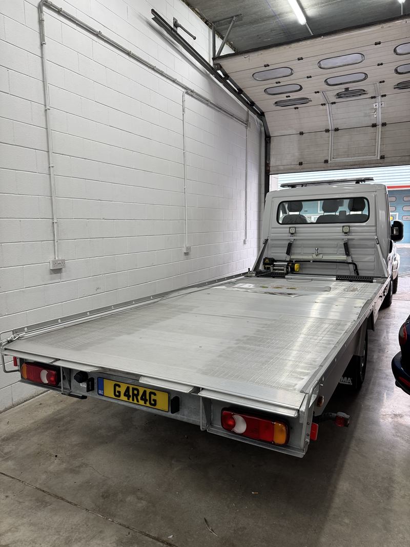 The tilting alloy deck of Altimore's Citroën Relay flatbed, with the winch and headboard.