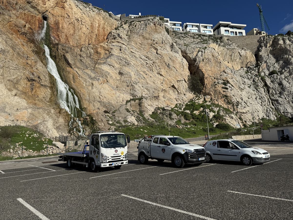 Altimore's flatbed, spec-lift and service van parked below the Rock of Gibraltar.